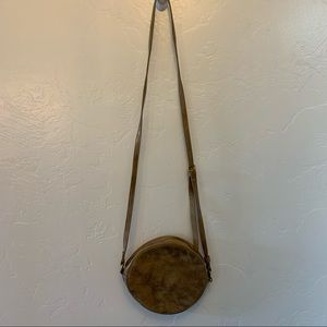 Circular brushed gold crossbody bag